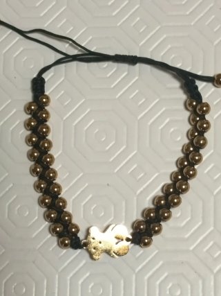 Pulsera Tous dorada y negra