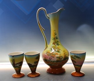 Jarra, jofaina y cuatro vasos de porcelana. Cerámica de Loucarte, Portugal.
