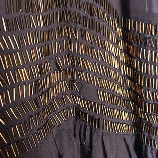Vestido Purificación García marrón y dorado