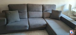 Sofá modular gris con almacenaje