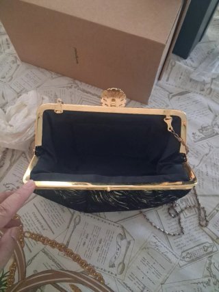 Bolso de fiesta negro y dorado