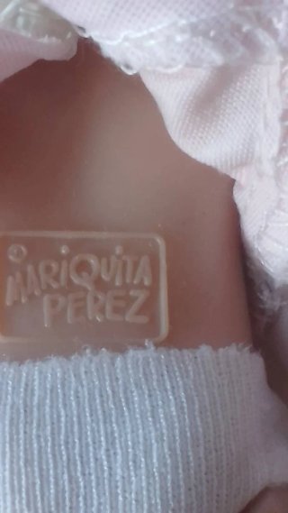 Muñeca antigua y sonajero plata