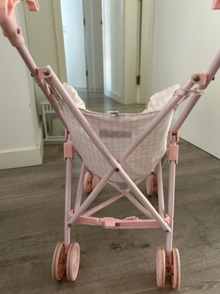 Silla de paseo para muñecos rosa