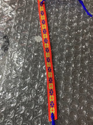 Pulsera tejida multicolor