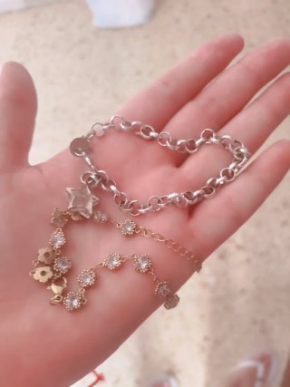 Pulseras de plata y oro con estrellas y cristales