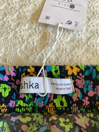 Falda mini Bershka floral fruncida XS