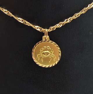 Colgante de oro de 18k. Zodiaco Cáncer. 0.94gr.