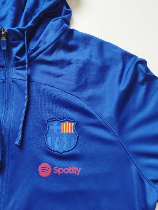 Chaqueta Nike Azul con Escudo y Logo Spotify
