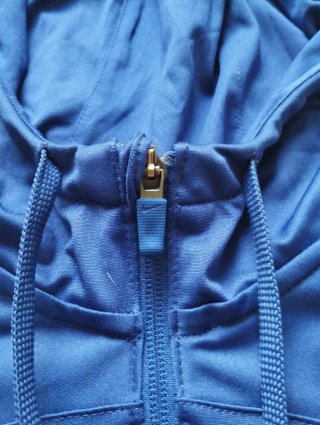 Chaqueta Nike Azul con Escudo y Logo Spotify