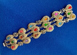 Pulsera brazalete dorada y piedras multicolor