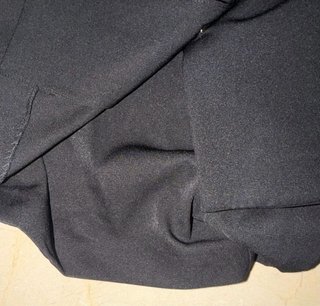 Mono blazer negro con botones joya