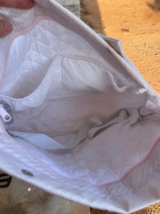 Bolsa de bebé con bolsillo y lazo