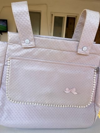 Bolsa de bebé con bolsillo y lazo