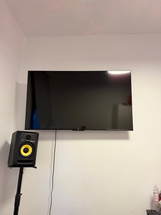 TV TCL 55” 4K Google TV con base para pared nueva