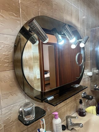 Espejo de baño ovalado con apliques de luz