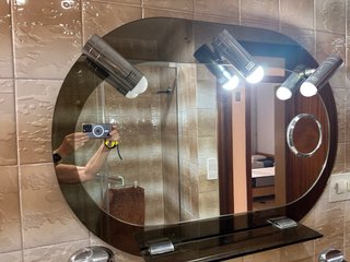 Espejo de baño ovalado con apliques de luz