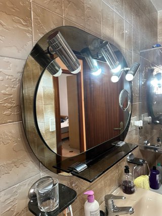 Espejo de baño ovalado con apliques de luz