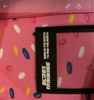 Mochila Elitex  multicolor con diseño de donuts