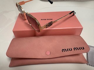 Gafas de sol Miu Miu doradas y marrones