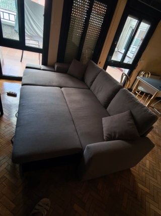 Sofá chaise longue gris convertible en cama
