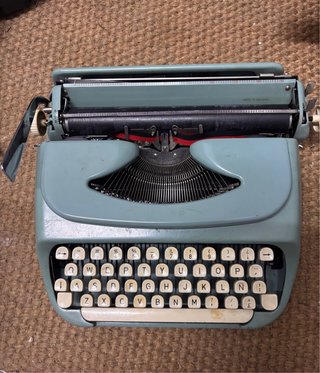 Máquina de escribir vintage azul