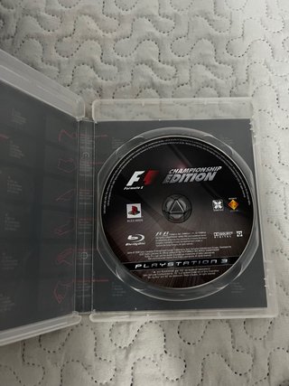 PS3 Slim con 2 mandos y 1 juego