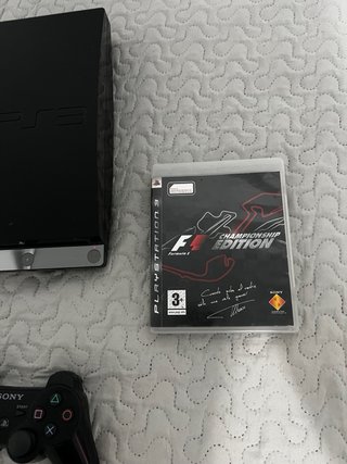 PS3 Slim con 2 mandos y 1 juego