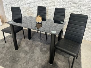 Mesa de cristal con 4 sillas negras