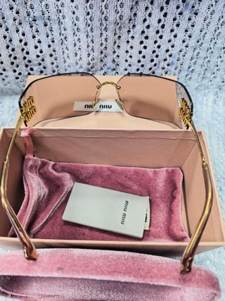 Gafas de sol Miu Miu doradas y rosas