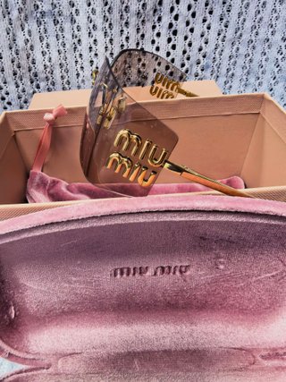 Gafas de sol Miu Miu doradas y rosas
