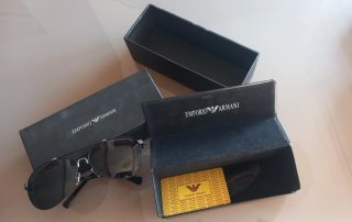 Gafas sol Emporio Armani negras montura metálica.