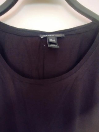 Blusa negra con lentejuelas plateadas