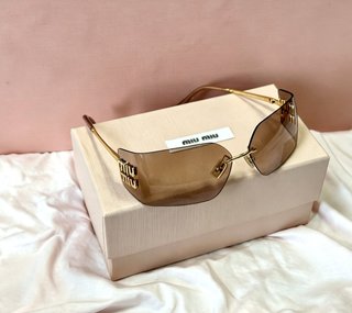 Gafas de sol Miu Miu Marrón y Dorado