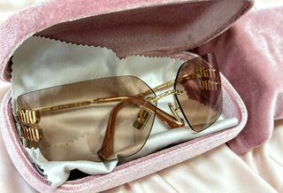 Gafas de sol Miu Miu Marrón y Dorado