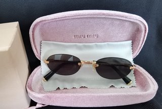Gafas de sol Miu Miu originales modelo oval dorado