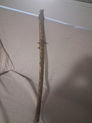 Espada con cabeza de dragón