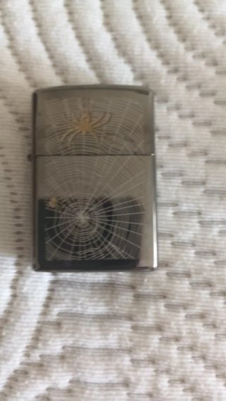 Zippo con design di ragnatela e ragno