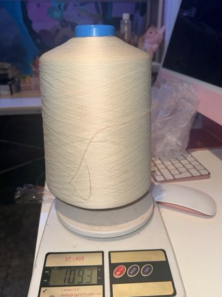 Hilo espumilla beige remallado