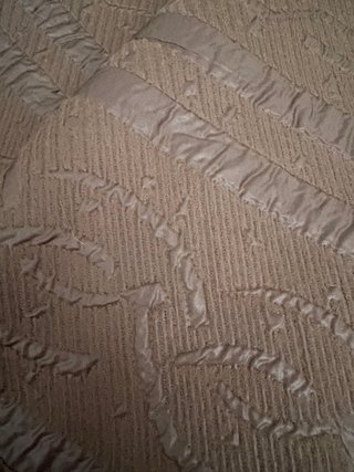 Tela beige con relieve texturizado