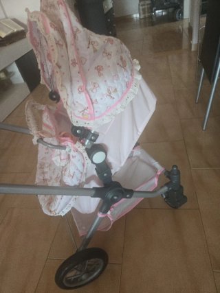 Carrito de muñecas rosa