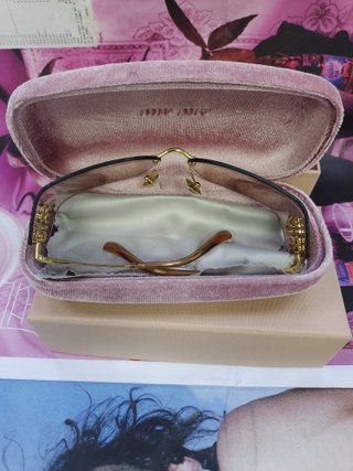 Gafas de sol Miu Miu marrones y doradas