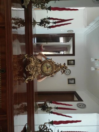 Reloj de bronce y candelabros a juego