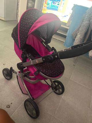 Carro de muñecas rosa y negro