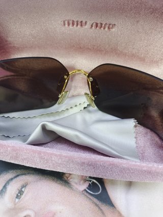 Gafas de sol Miu Miu marrones y doradas