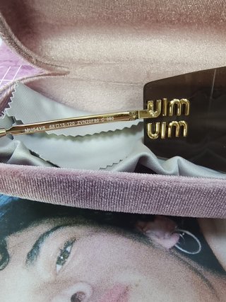Gafas de sol Miu Miu marrones y doradas