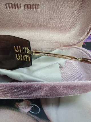 Gafas de sol Miu Miu marrones y doradas