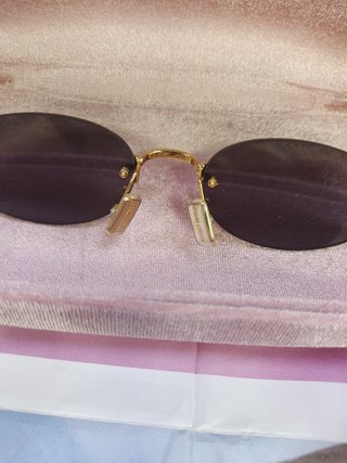 Gafas de sol Miu Miu ovaladas doradas