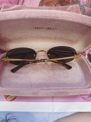 Gafas de sol Miu Miu ovaladas doradas