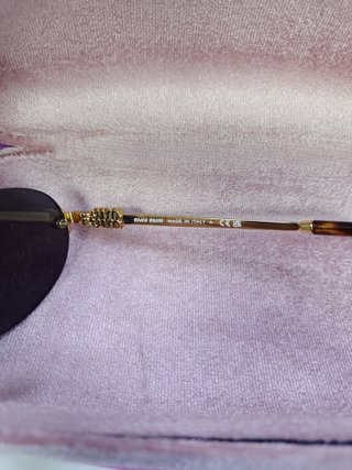 Gafas de sol Miu Miu ovaladas doradas