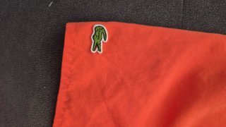 Bañador niño Lacoste naranja Talla 8 años.